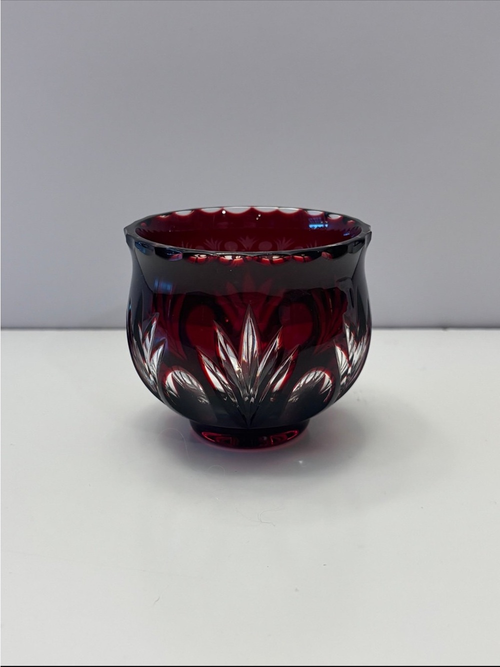 Bohemian Red Crystal glass votive candle holder features intricate cut-to-clear